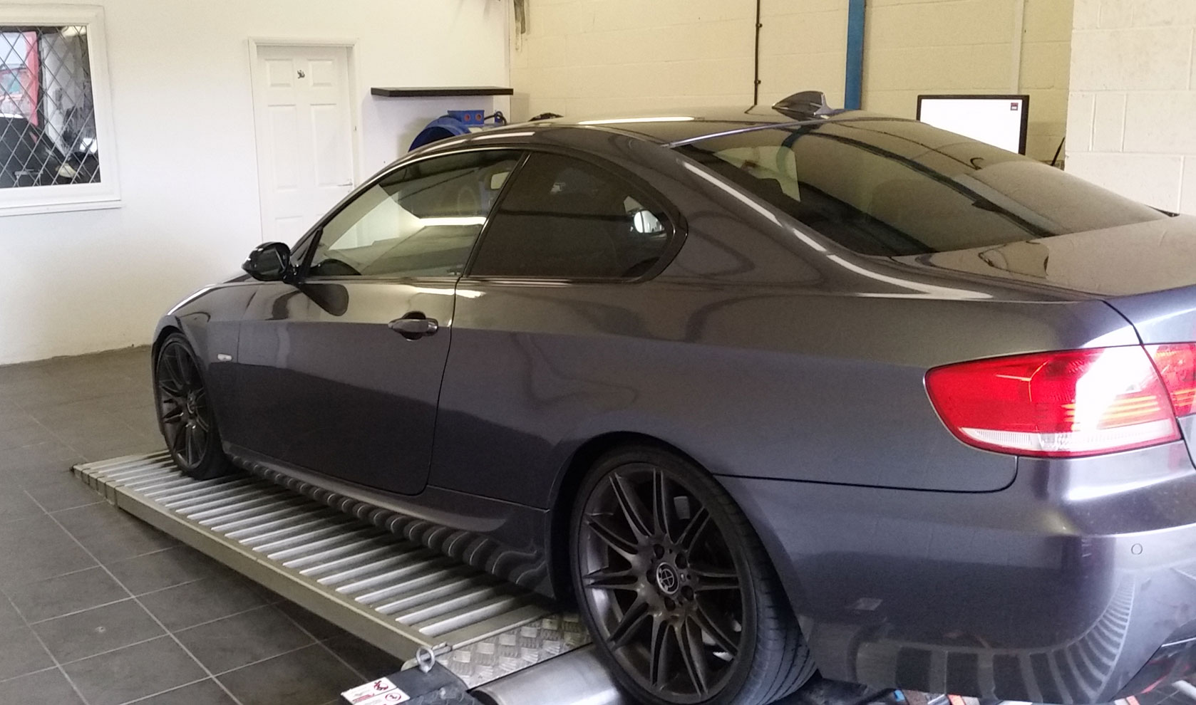 BMW positioned on a rolling road for tuning